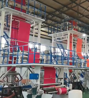 Three-layer co-extrusion express bag film blowing machine